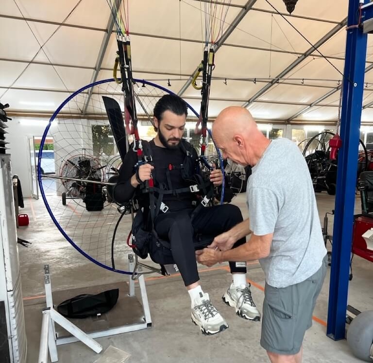 Sitting in the simulator, getting instructions from my patient instructor Salam Waddah sitting in a paramotor simulator